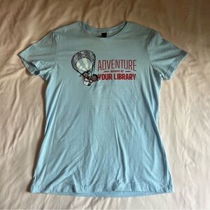 “Adventure Begins at Your Library” Women’s Tee - Size Large